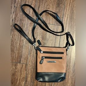 Stone Mountain USA, LLC crossbody bag. Bonus wristlet strap. Black & tan.